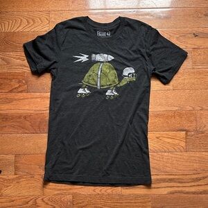 Black T-Shirt with Green Turtle Graphic